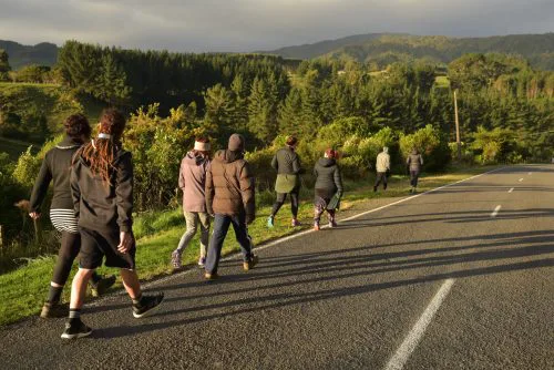 Image showing about ten people off for a hikoi (walk) down the road during the 2017 Flourishing Fellowship